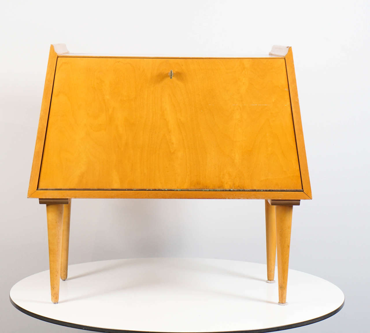 This pair of maple tables was created by Swedish Designer Edmund Spence in 1950.
A unique and rare form. Front door opens to reveal a interior drawer with storage.
Manufactured and imported by Walpole.