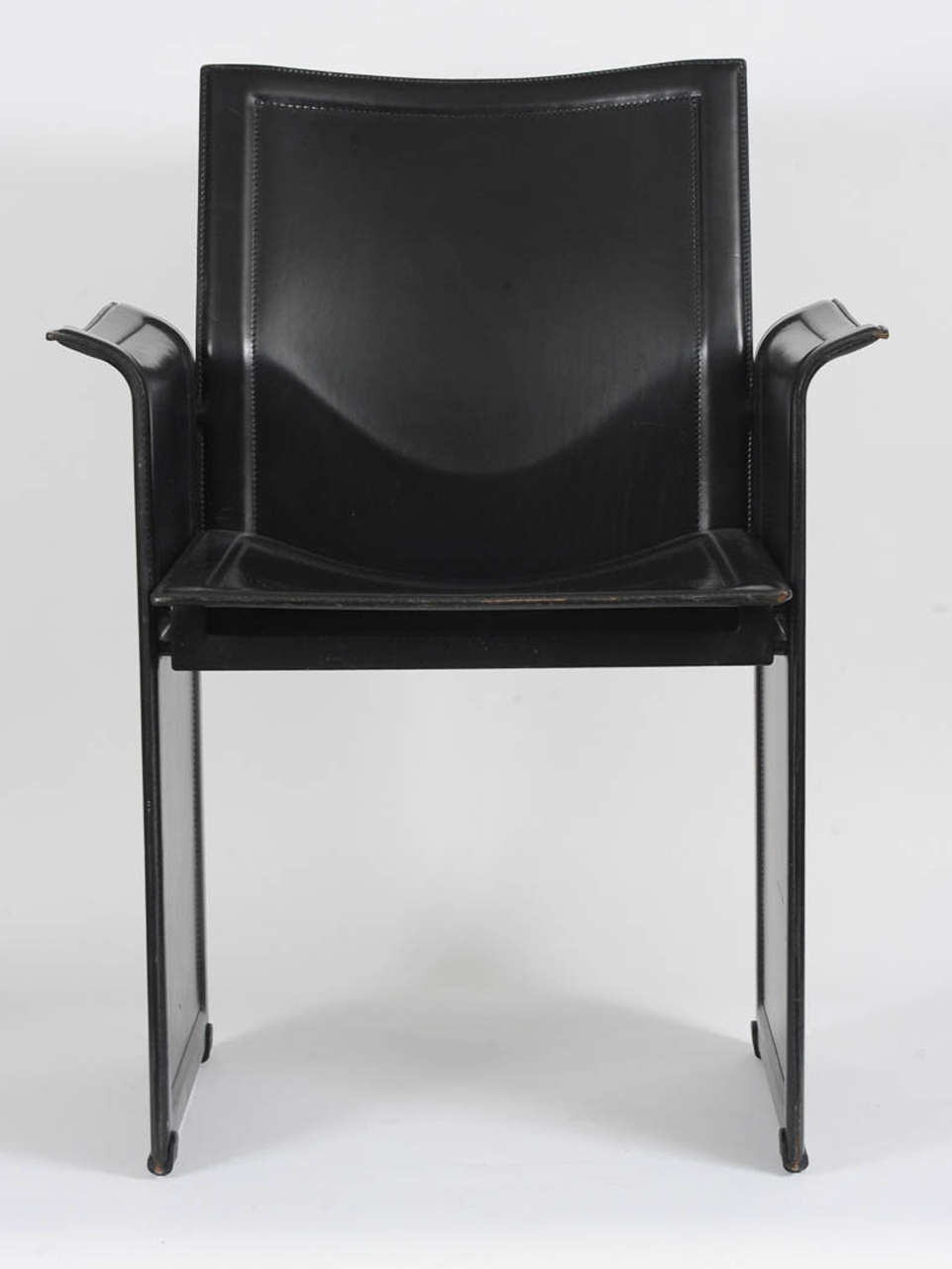 The Korio was designed by Tito Agnoli for Mateo Grassi.
Great quality black leather chair featuring four stitched & molded leather pieces on metal frame panels.