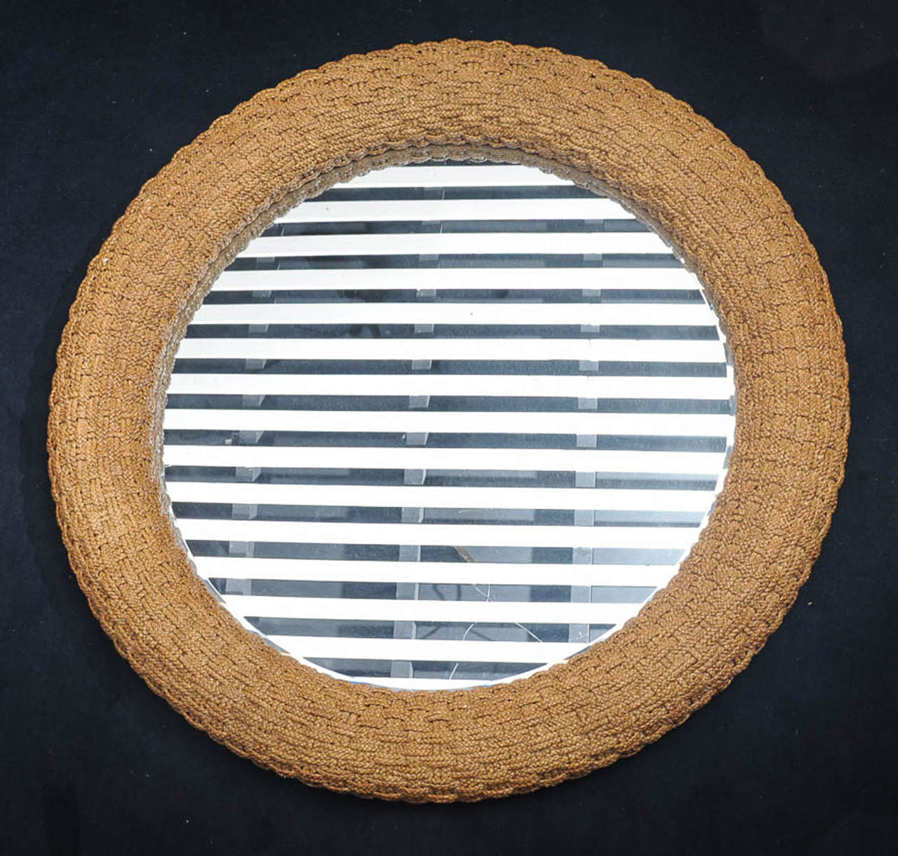 Woven nautical mirror signed 'Lexington 899-201 Nautica Mirror Made in USA.'
With its diameter of 127cm (50 inches) this late 1970s mirror is a true eyecatcher in any room. Perfect for a grand scale beach house, this great quality beveled mirror is