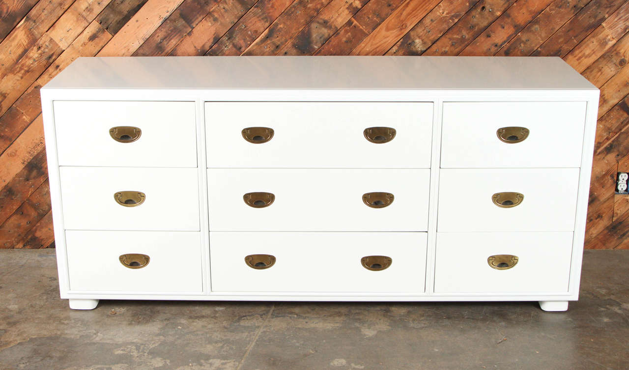 Gorgeous refinished and lacquered White Mid Century 9 drawer dresser by Drexel.  Brass pulls have been polished. New Lacquer is in perfect condition.