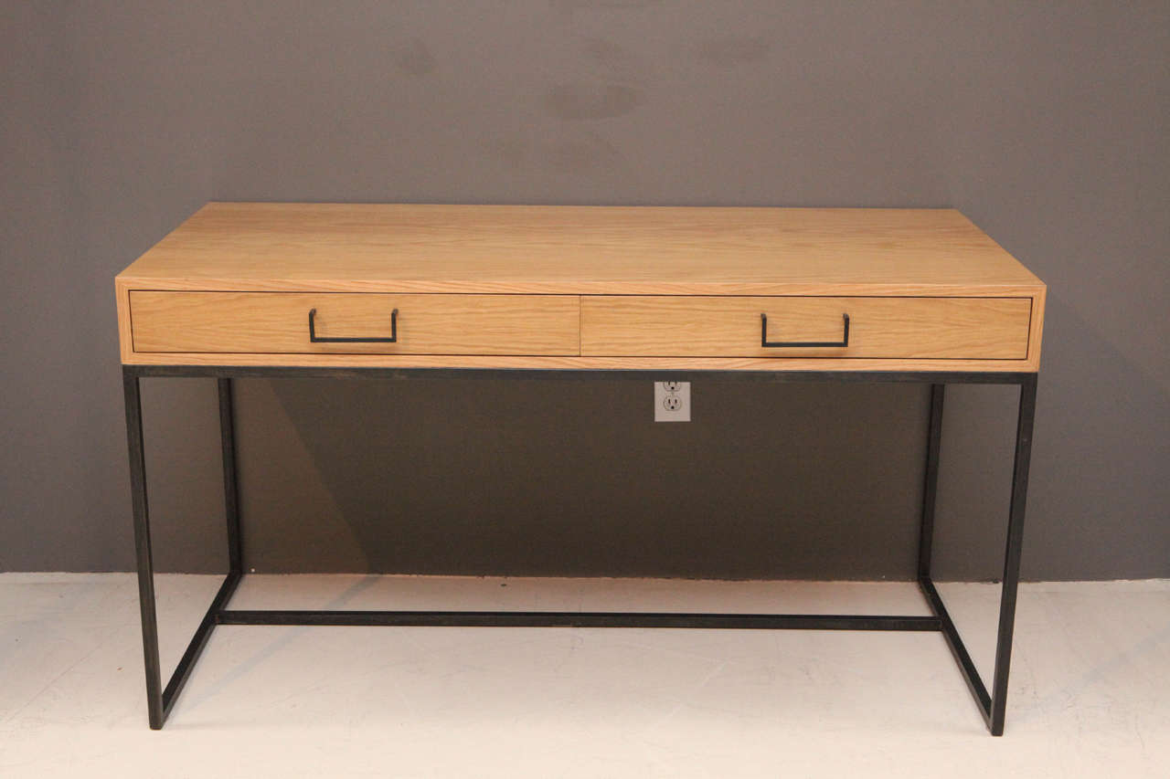 The Thin Frame Desk has two drawers, each with its own pencil tray and features a plated steel base and handles. Shown here in Natural Oak and Matte Black Powdercoat.

Made to order in various finishes with a 10-12 week lead time.