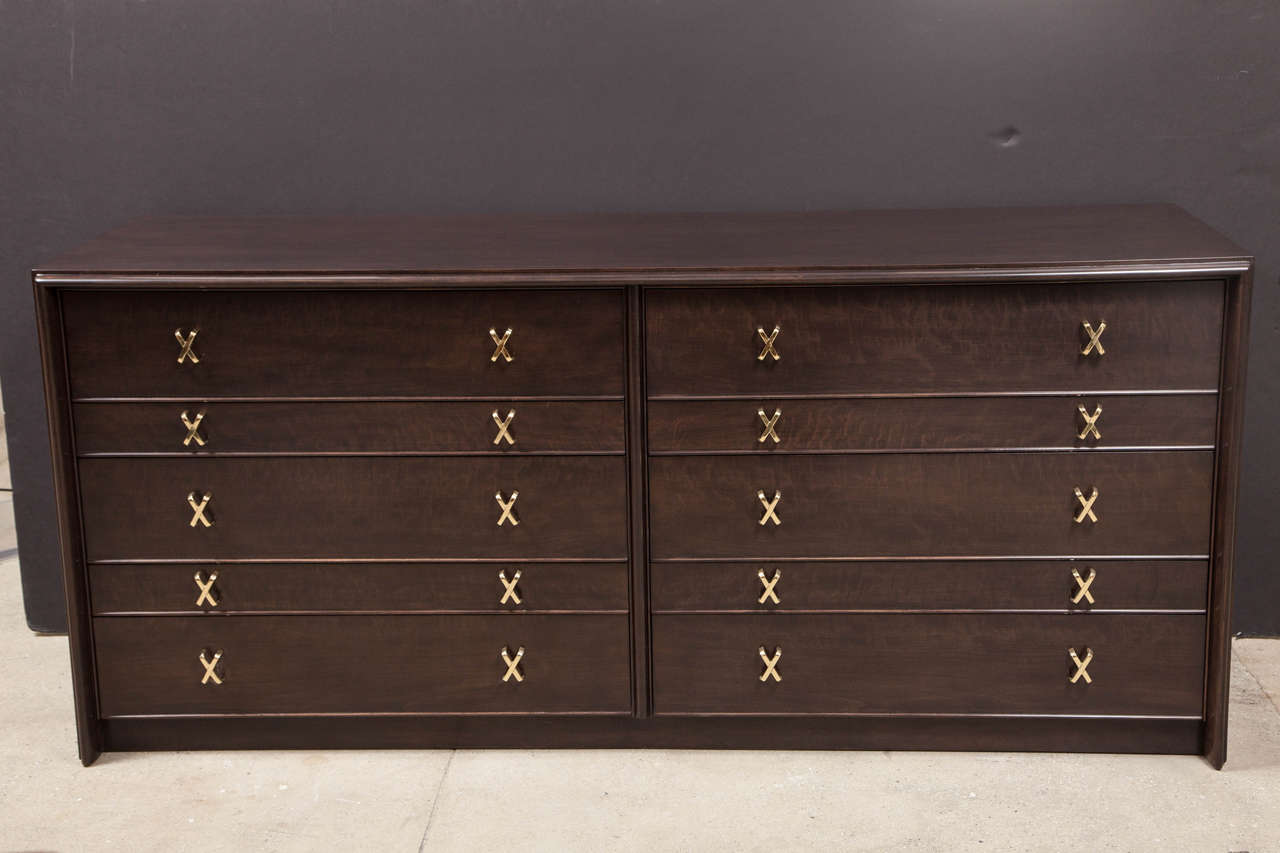 Classic Mid-Century Modern dark stained Walnut ten-drawer dresser with polished brass X  pulls. Mint restored condition. Retailed thru John Stuart.


      