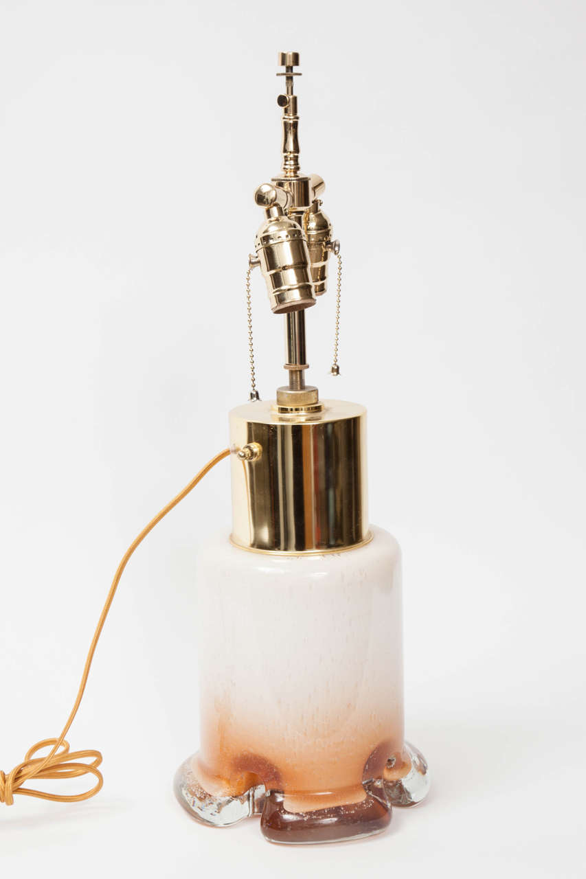 Italian Mid-Century glass lamps with a white/amber ombre effect. Lamps have been rewired with double pull chain sockets and have the capability to be illuminated internally.
