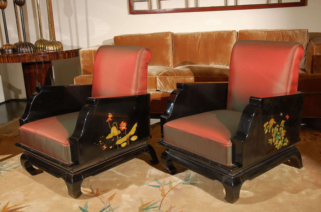 Black lacquer salon chairs with chinoiserie hand painted floral motifs on arms.
One chair decorated with lotus blossoms and the other with chrysanthemums.
Unique chinoiserie frame and legs. Chartreuse silk and silk trim as the upholstery.