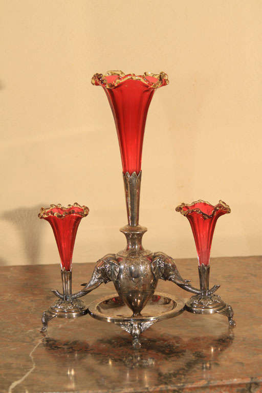 Silver plate and cranberry glass epergne. Created by George Wish for Sheffield at Denmark Works. Edwardian period with elephant motif.