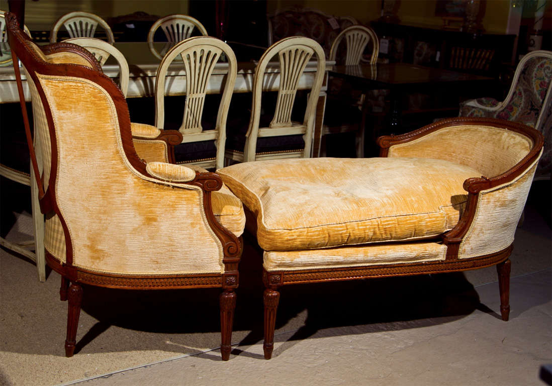 Fabulous French Louis XVI style walnut Duchesse Brisee, circa 1940s, the bergere with winged back, padded armrests, cushioned seat; the lounge with domed back and cushioned seat, all raised on tapering fluted legs.  Stamped Jansen<br