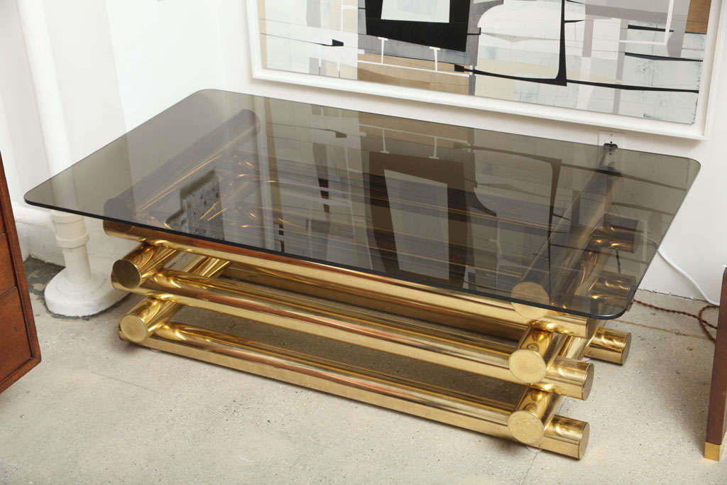 Willy Rizzo (attr) coffee table made of stacked steel/brass plated cylinders and a smokey acrylic top with rounded edges.