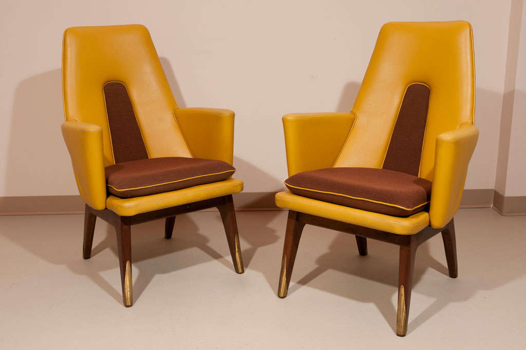 Pair of modernist armchairs made by Boling Chair Co. 1963 (label still intact). Would make great accent chairs. In original vinyl and wool. Brass accents on mahogany legs. Delivery to NYC available every 2-3 weeks.