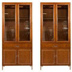 Pair of tall moderne cabinets with glass doors by Henredon