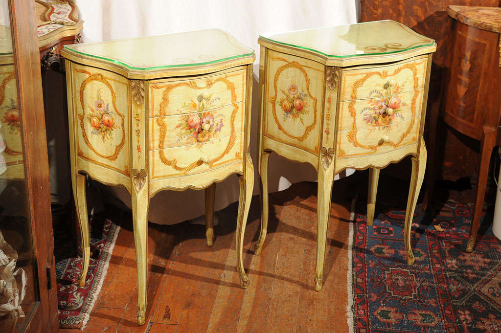 These nightstands will brighten any bedroom setting with their creamy color and curvy lines.  The soft lines and floral decoration can soften any room.  Plate glass tops were custom made to protect the finish.