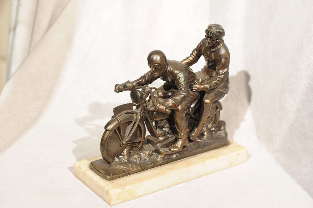 This hard to find subject matter is one of the most sought after themes in the collectible world.  This fabulously detailed statue depicting the riders and the motorcycle is a true gem.  Mounted on a nice original marble base gives it a solid