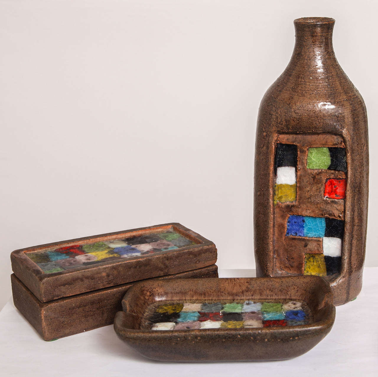 Beautiful set of three coordinating pottery pieces with mosaic inlay. From the Fritte Colorate series manufactured under Aldo Londi at Bitossi circa 1957-1959.

Measurements:
Box 7.5 x 4 x 2.5
