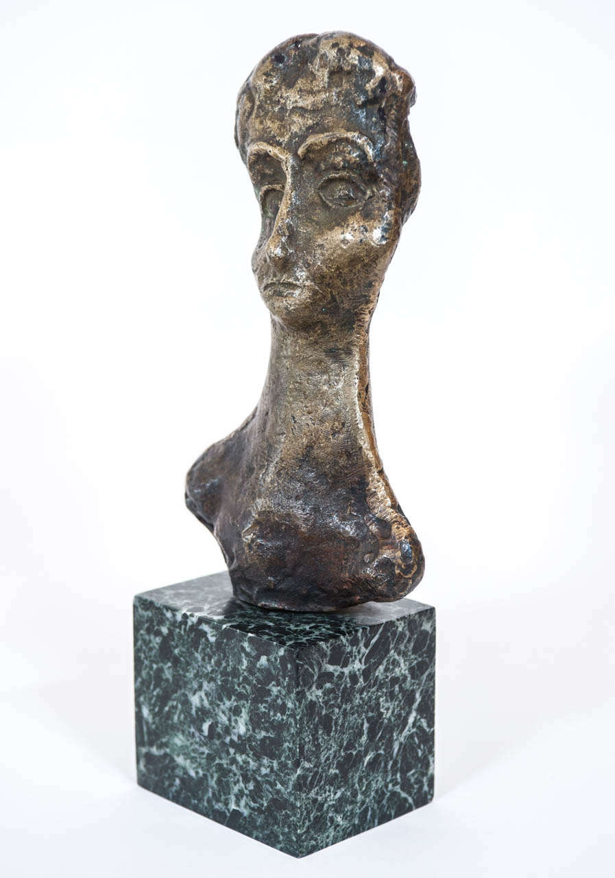 This pensive and doleful bust is mounted on marble and by a Greek artist
with the initials A K.
It came from the same collection that the large bronze bust of a horse listed on our 1stibs store front.
