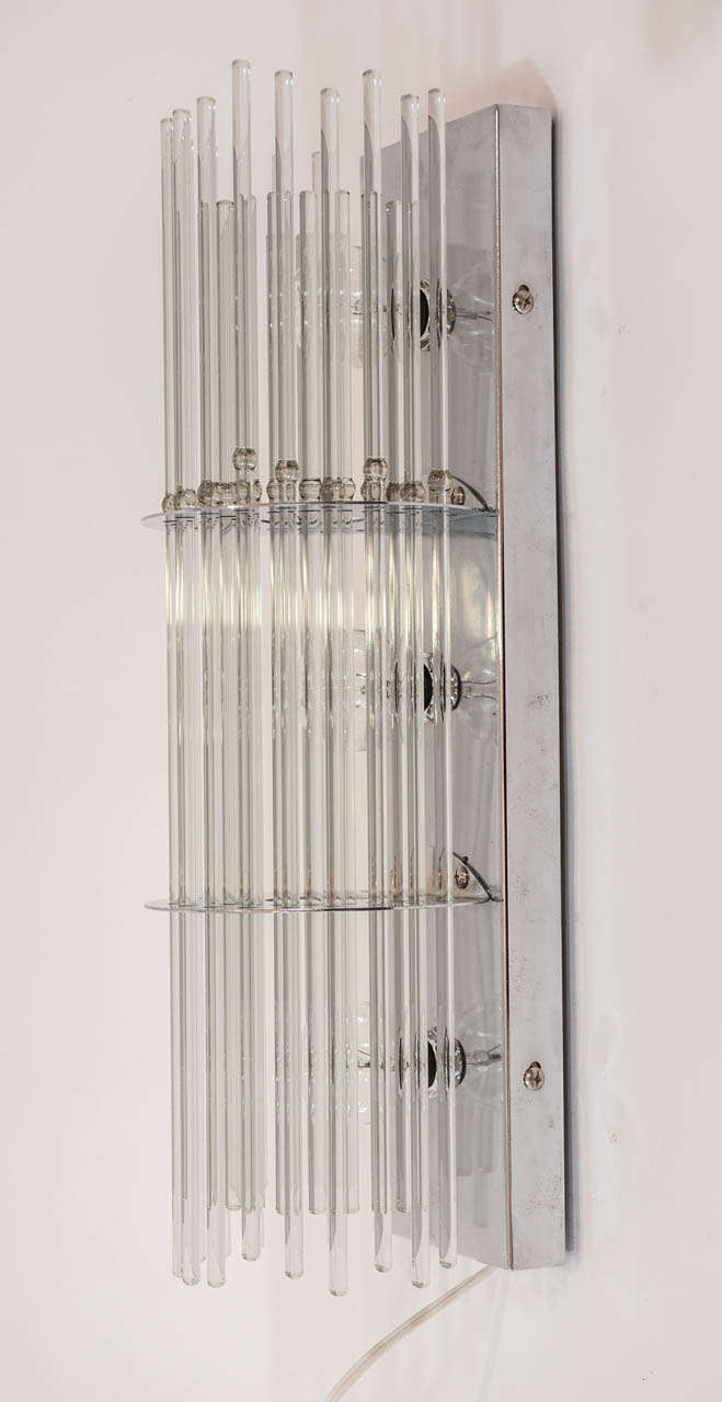 These functional and modern glass rod sconces are simple yet chic and add 
glamour to any room.