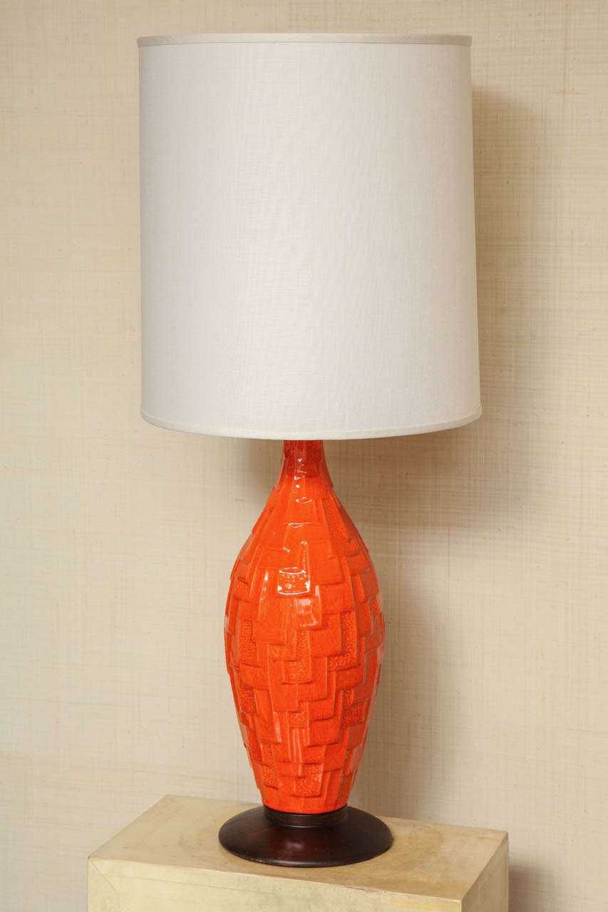 Pair of orange glazed ceramic lamps with textured geometric design c. 1960