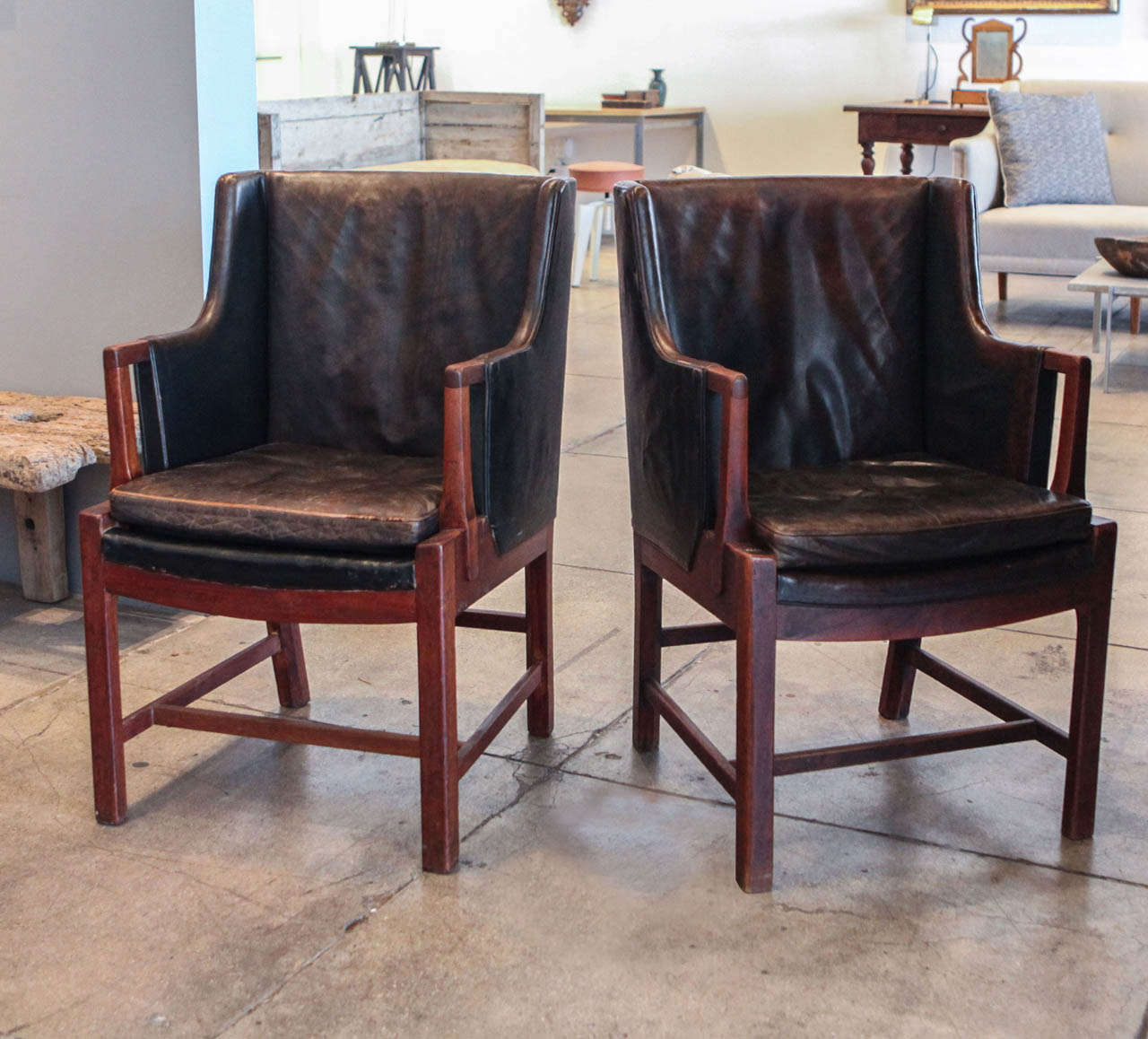 a pair of teak base library chairs made by un unknown cabinet maker in the late 1930's. *sold only as a pair.