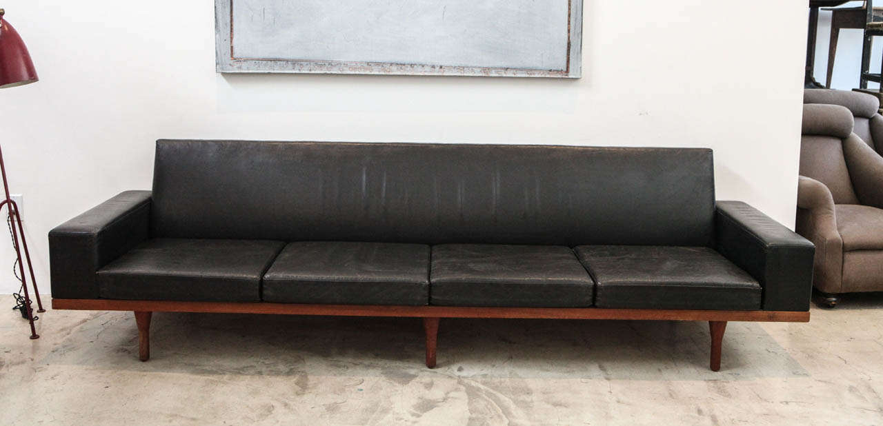 A very small-produced sofa by one of our favorite Danish designers, Illum  Wikkelso. In its original teak frame and black leather.