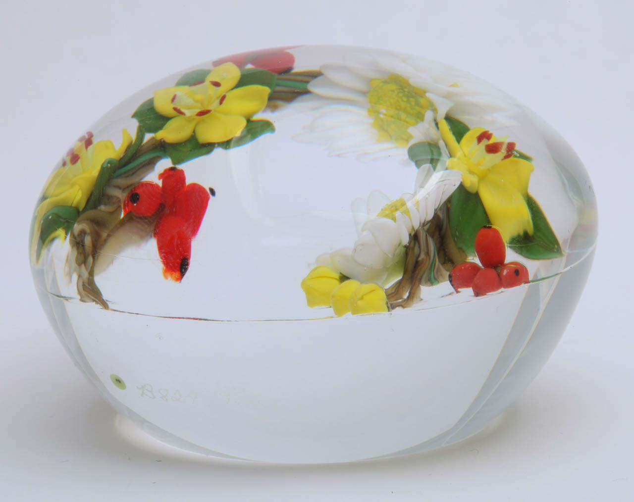 A beautiful Paul Stankard braided stem bouquet paperweight with white daisies, yellow meadowreaths and red berries, signed S for Stanakard, 1982