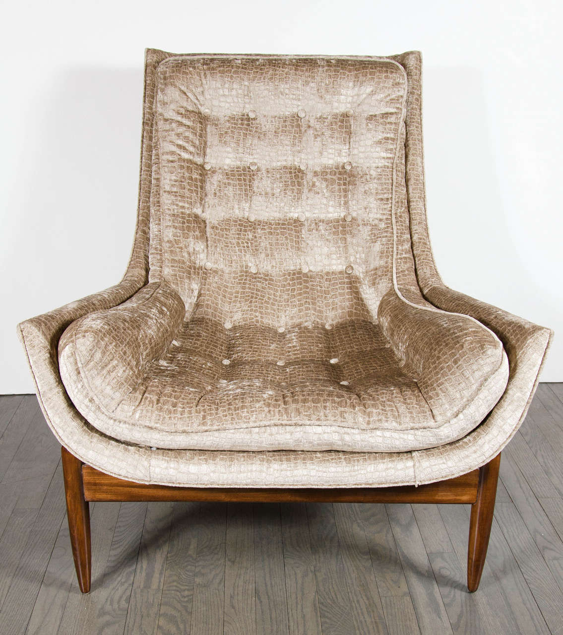 Mid-Century Modernist floating design lounge chair in the manner of Vladimir Kagan. This chic lounge chair in the manner of Vladimir Kagan is upholstered in a gaufragged smoked tobacco crocodile velvet and features a large sleigh design outer shell