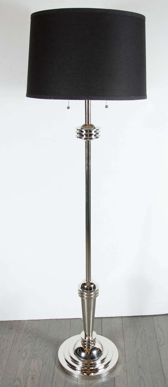 This Art Deco Machine Age skyscraper lamp is a great example of the skyscraper Machine Age's influence on Art Deco in America. Streamline skyscraper design in chrome, it's base has a four-tier layered base, as well as at the neck of the lamp. It