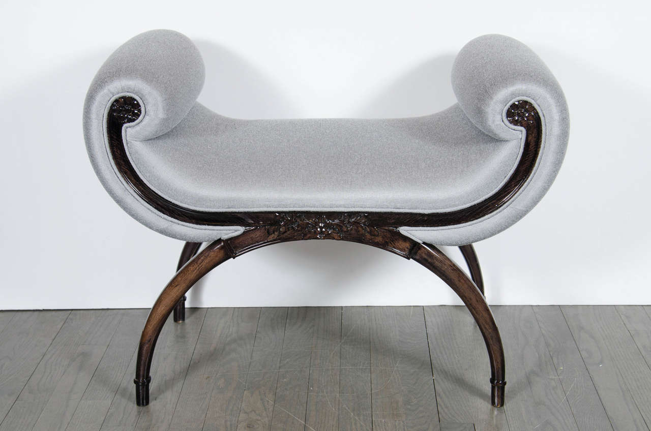 1940s Hollywood Regency scroll form bench by Grosfeld House in ebonized walnut with Platinum Sharkskin upholstery. This elegant bench by Grosfeld House is a remarkable piece from the Hollywood Regency period and features an accentuated scroll design