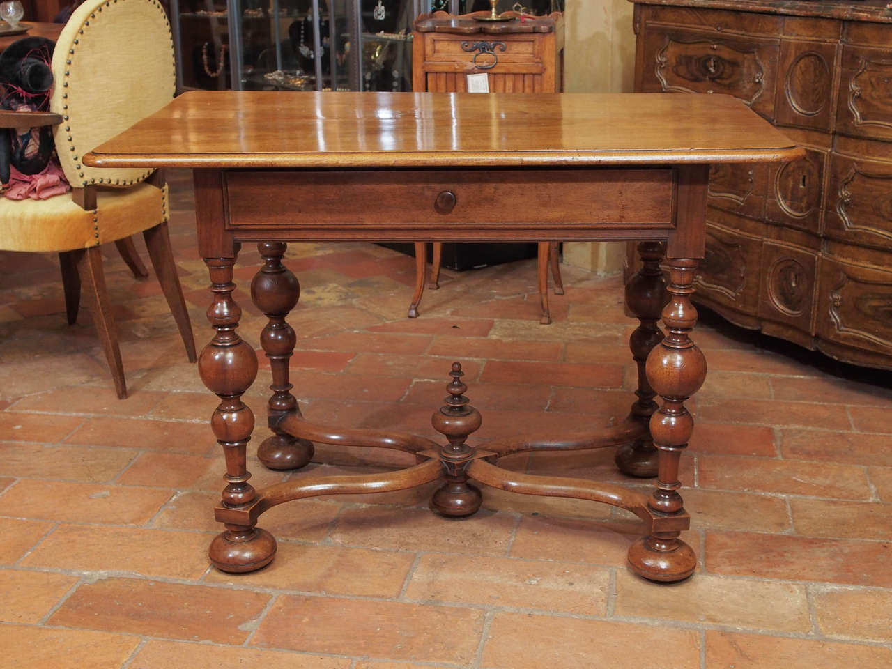 19th century French Louis XIII style walnut table from the Burgundy area, with one drawer, circa 1850.
