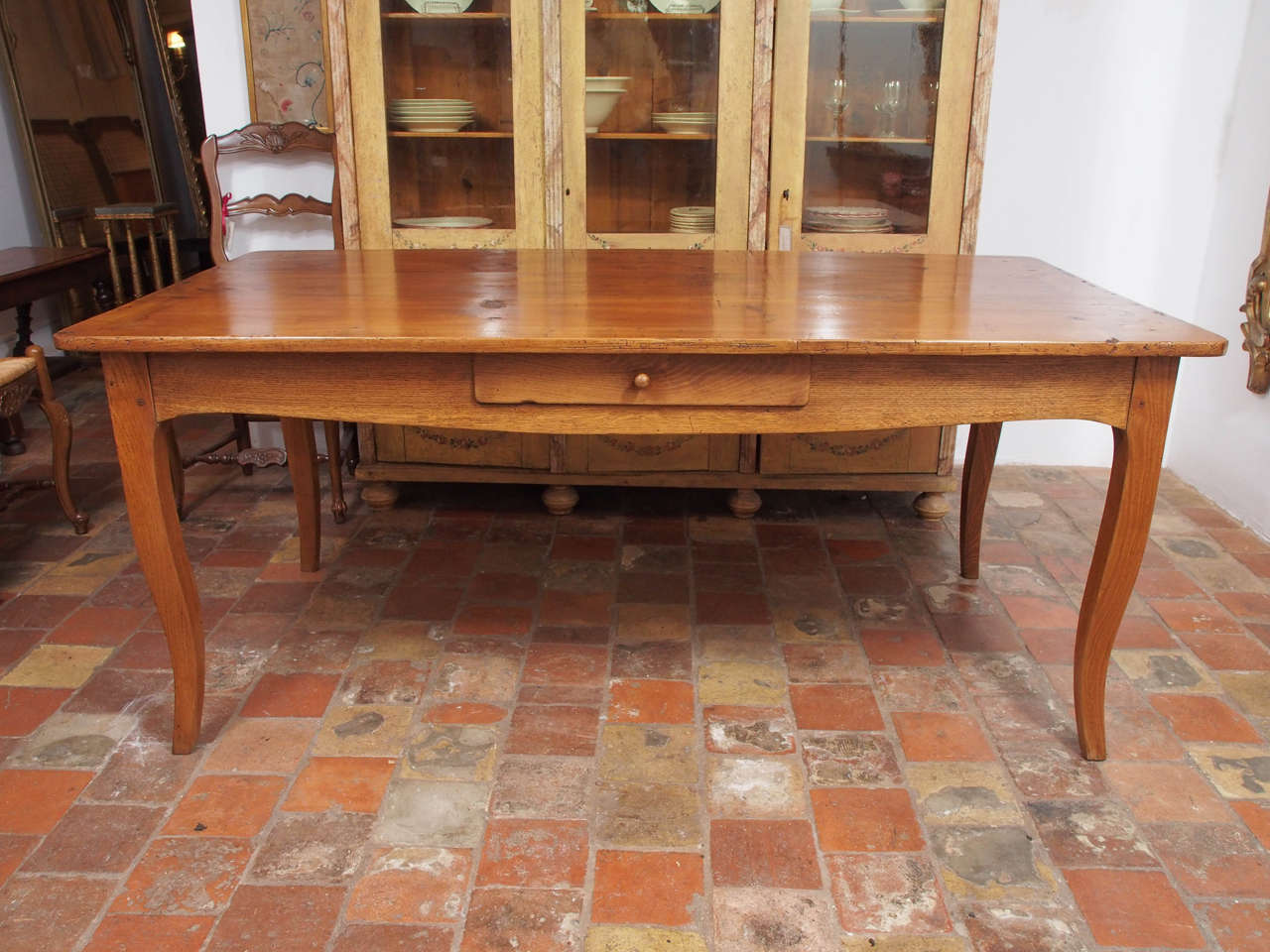 19th century French Louis XV style oak and pine farm table with one drawer.