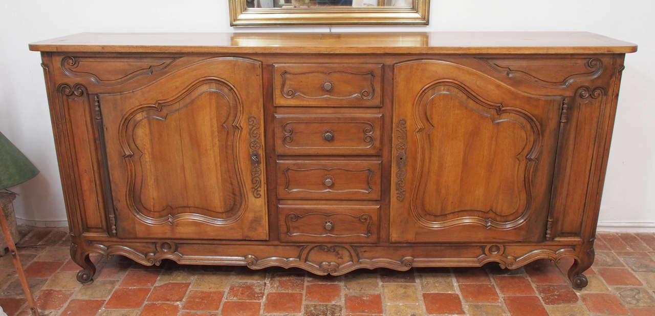 19th century French walnut enfilade with four drawers and two doors, circa 1860.