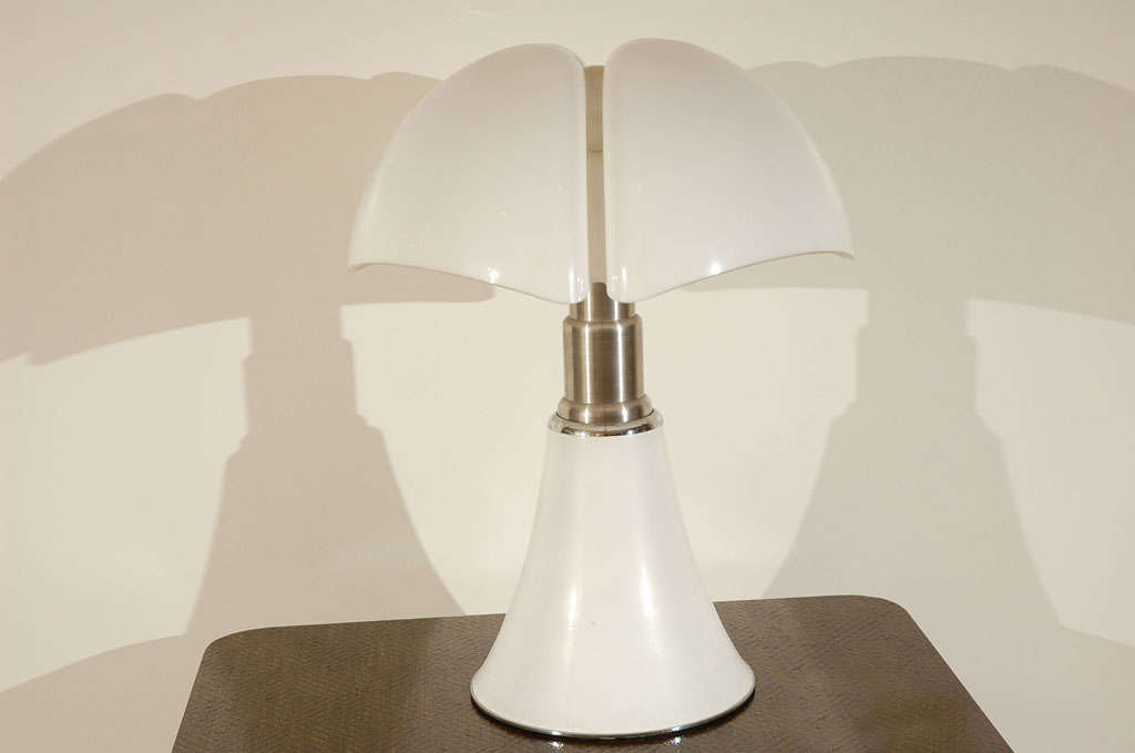 Table or floor lamp  designed by Gae Aulenti for Martinelli Luce in 1965.  The height can be adjusted by it's telescopic stem (height can be set anywhere from 26