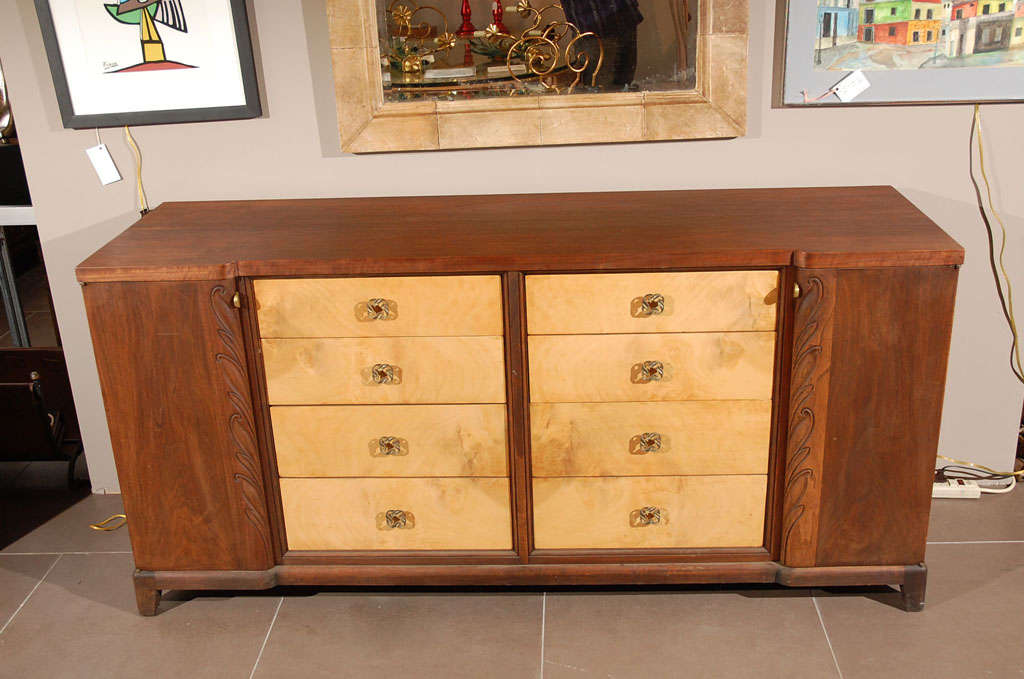 Beautiful French two tone wood buffet/dresser with brass pulls.  Six drawers in center section and pull out drawers inside the doors.