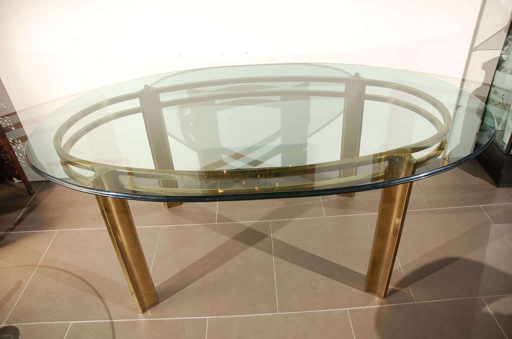 Mastercraft brass breakfast/dining table with curved bevel glass top.