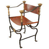 Iron and leather chair with brass finials