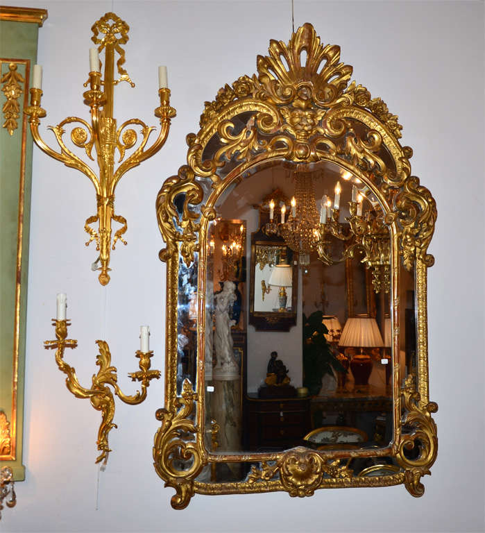 Very beautiful gilt wood mirror,  Regency style , very nicely carved, decorated with masks and foliages.