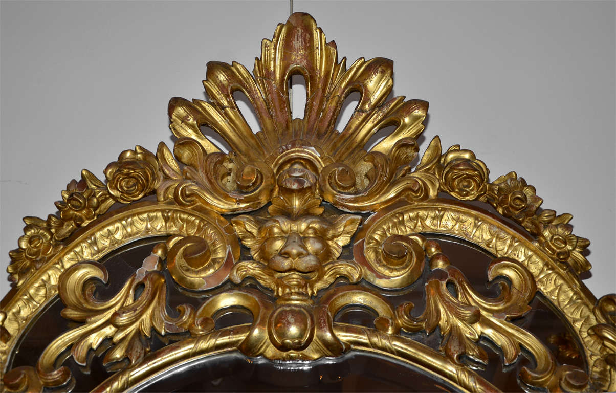 20th Century Very inusual gilded and carved wood mirror, Régence Style. For Sale