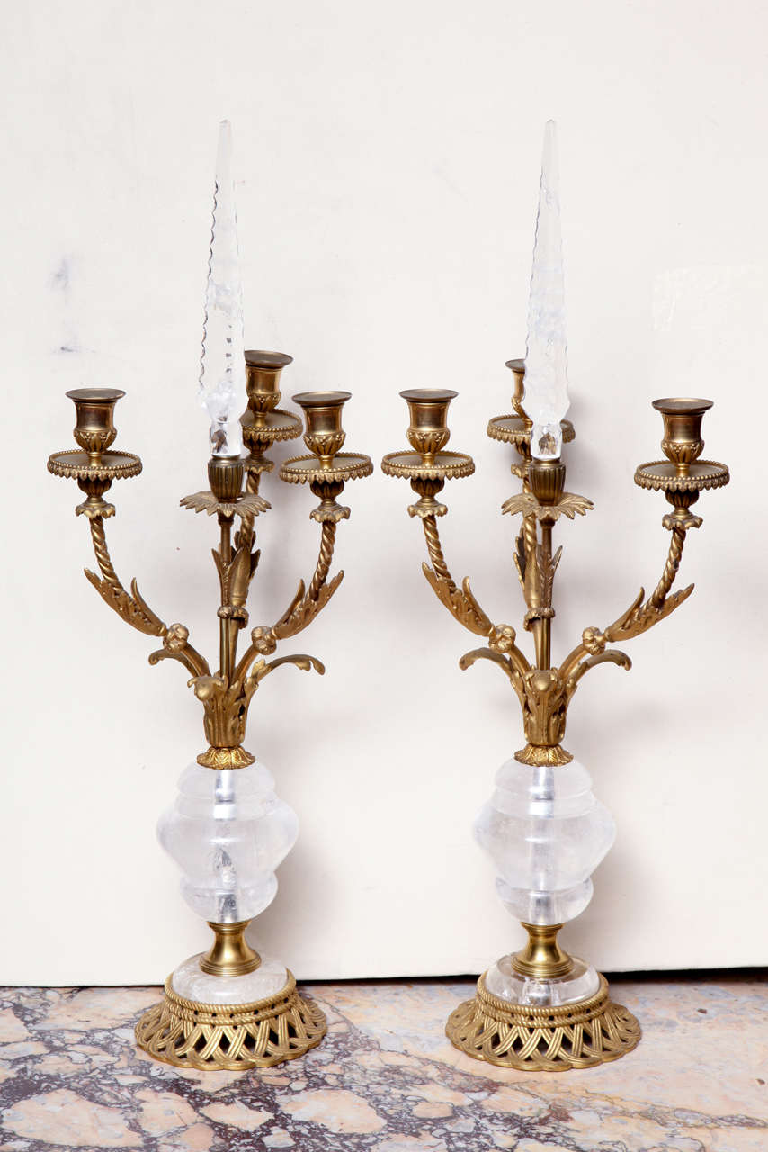 Pair of French bronze and rock crystal four light candelabras