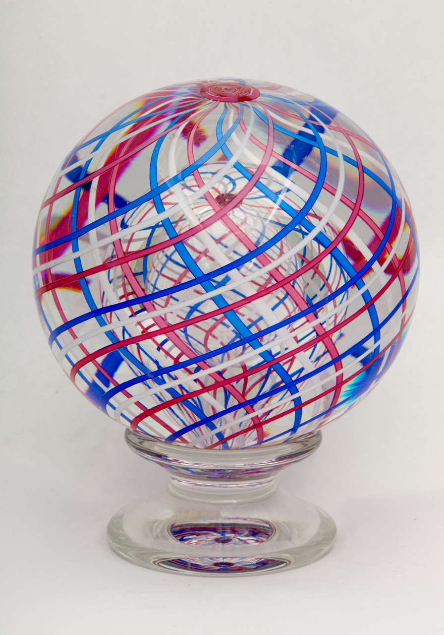 a 1977 St. Louis pedestal paperweight with swirling  pink, blue and white laticinio around a pink Clichy type rose cane, signed SL1977.