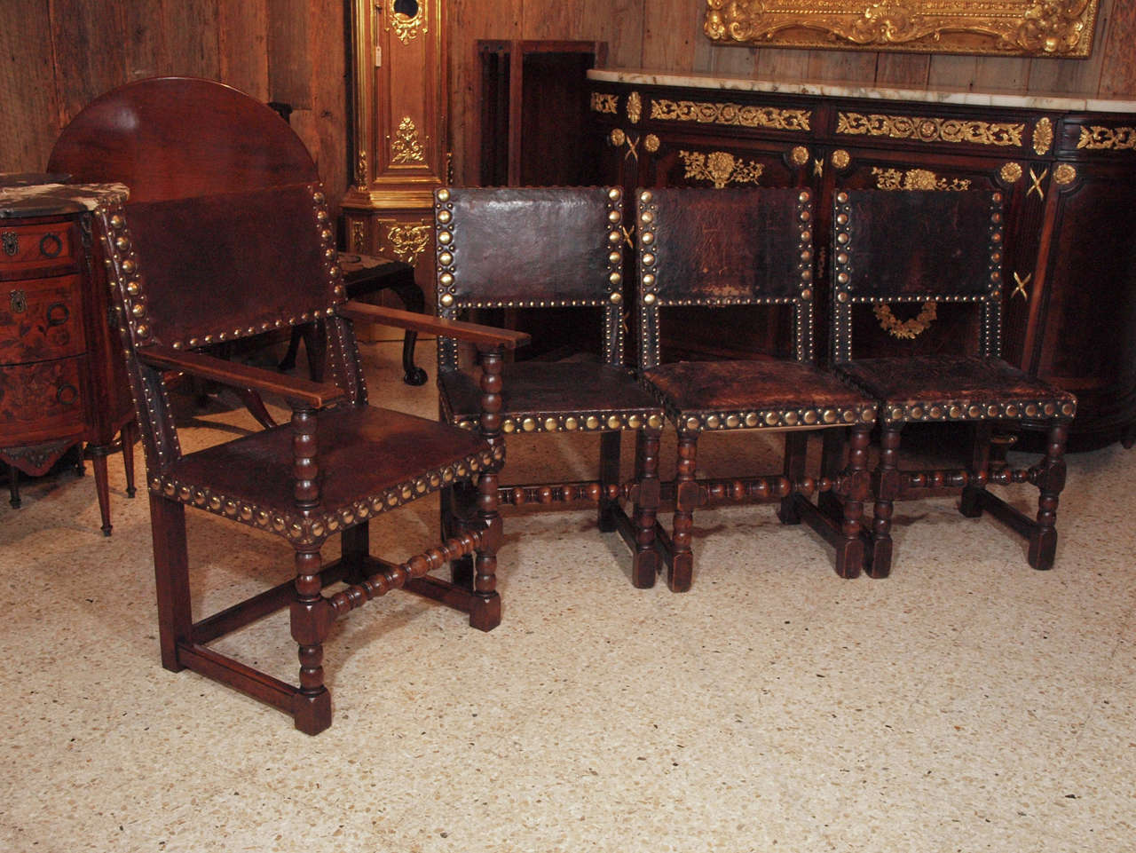 Set of 8 Antique English Oak and Leather Chairs with Brass Fittings.
Arms measure 35 3/4