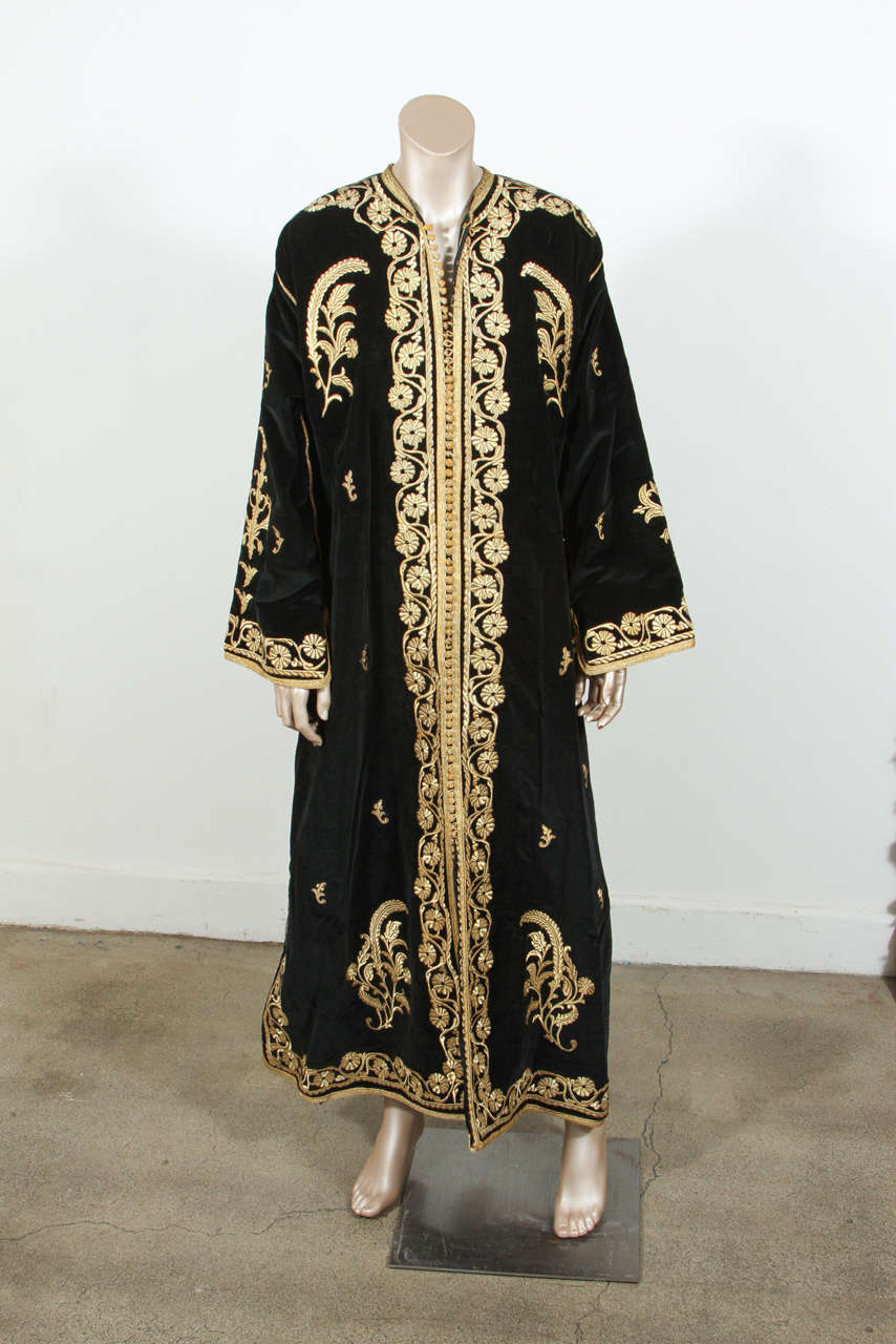 Amazing Vintage Caftan, black silk velvet heavily hand embroidered with gold threads. Circa 1960's
The black velvet kaftan is embroidered and embellished entirely by hand, super-luxe designer kaftan. One of a kind evening gown.
This authentic