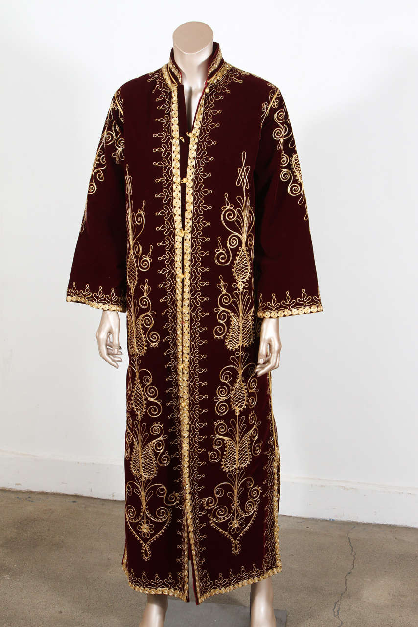 Elegant Moroccan caftan, embroidered with Turkish metallic gold threads design all over.
This dark burgundy wine color velvet Bohemian style kaftan is embroidered and embellished entirely by hand, super-luxe designer kaftan.
One of a kind evening