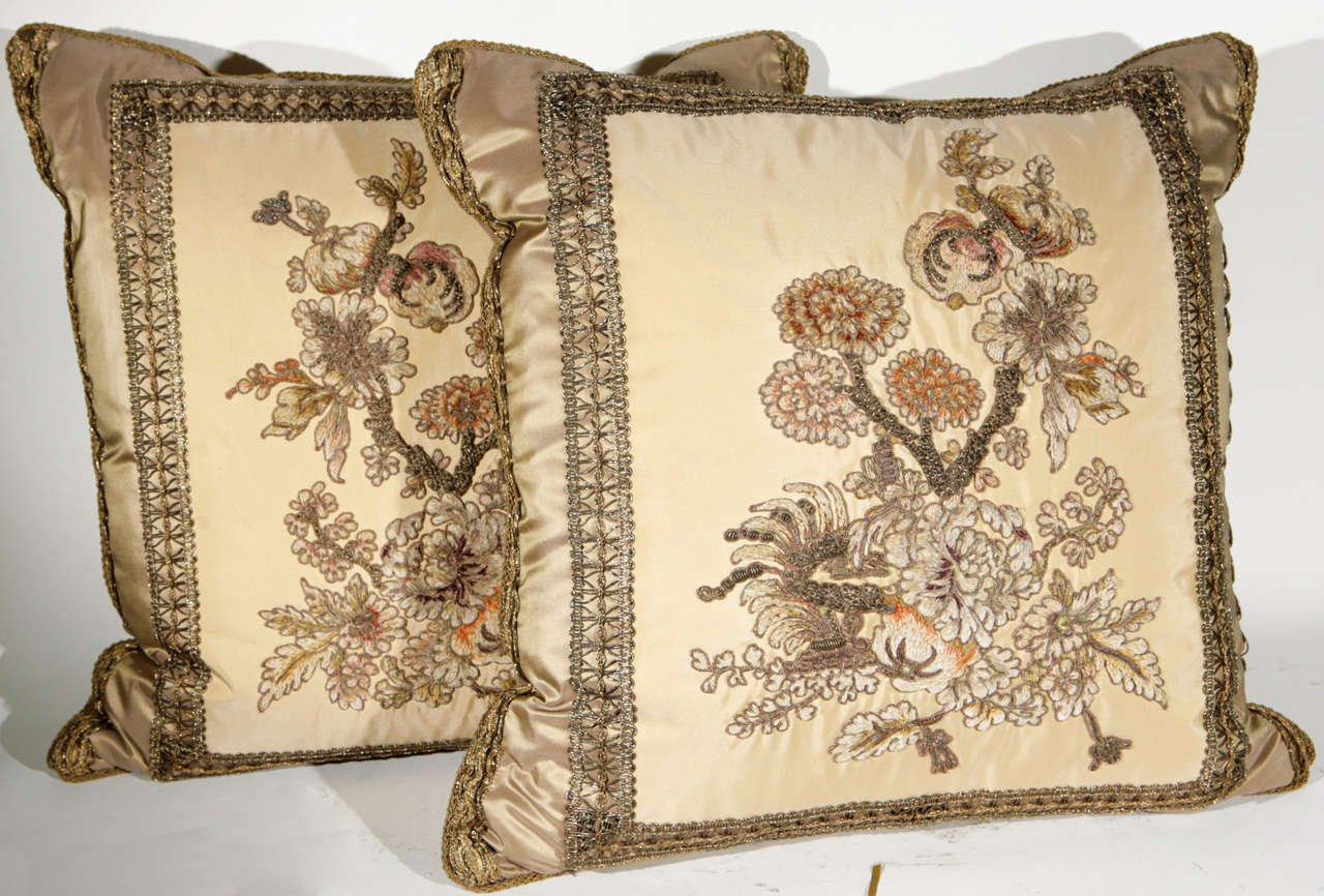 A very fine pair of early 19th c. French Fragment Pillows. The  metal thread tapestry fragments have been meticulously restored and masterfully sewn onto silk fabric to create these beautiful pillows. Decorative silk trim has been applied to finish