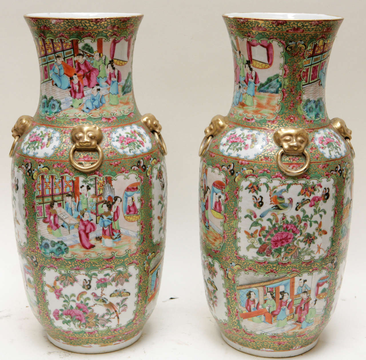 Pair of 19th c.Chinese Rose Medallion Vases with Foo Dog and Ring Motif.