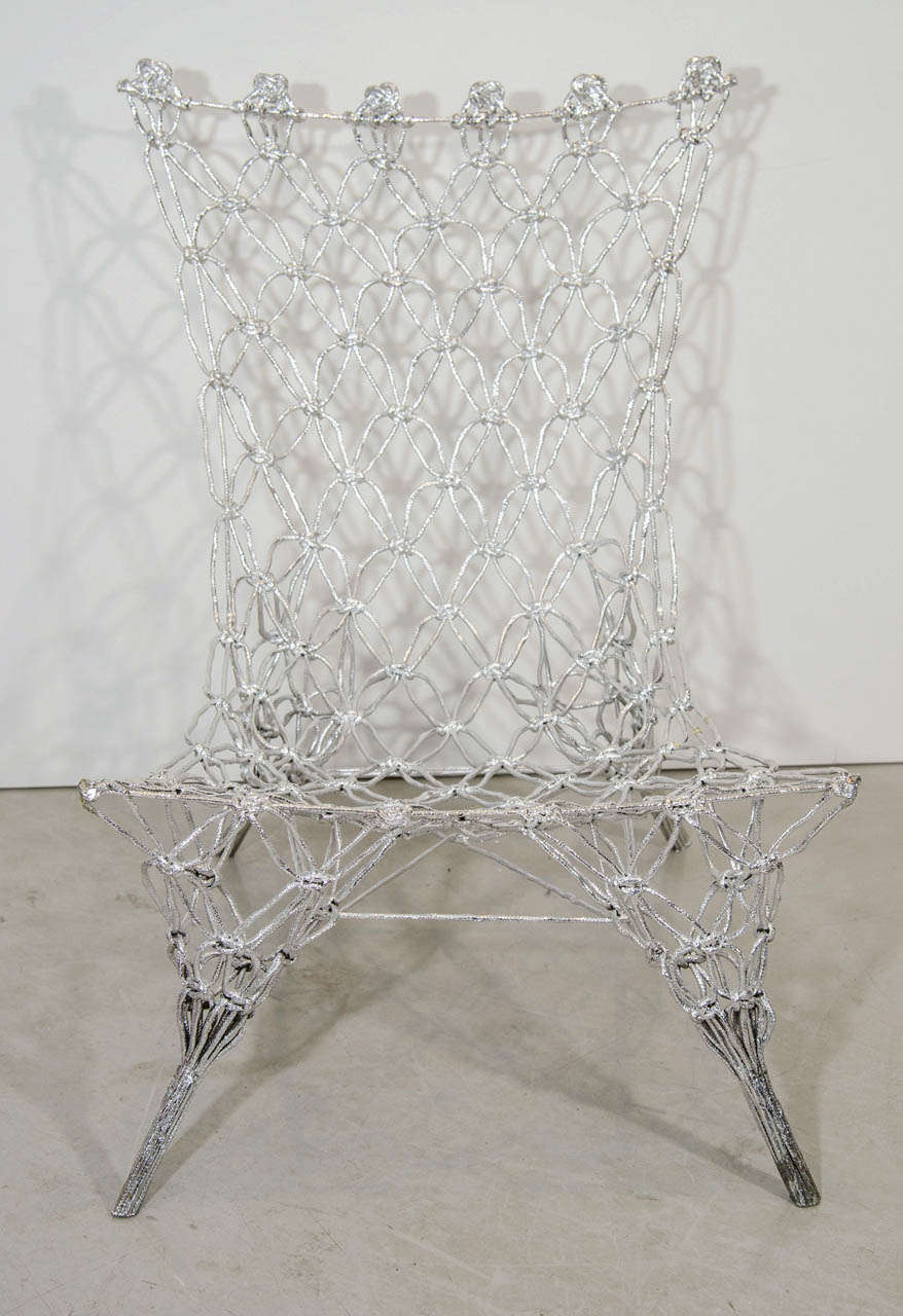 Limited edition of the iconic knotted rope chair in chrome epoxy.