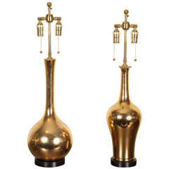 Ying and Yang.   A mismatched pair of ceramic table lamps with a brilliant gold glaze