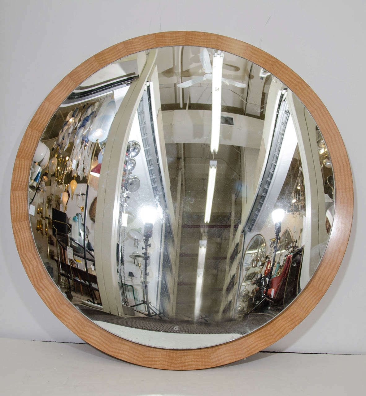 A 21st century convex wall mirror with birchwood circular frame.

Good condition. Some wear around the edges of the mirror and some scratches.