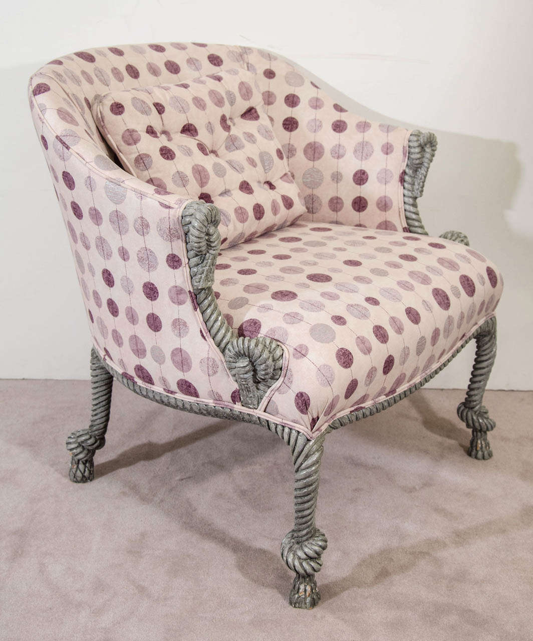 A pair of vintage Italian armchairs with purple hued polka dot upholstery, and painted wood frame carved with a tassel motif.

Good vintage condition with age appropriate wear.  Some loss to grey paint.