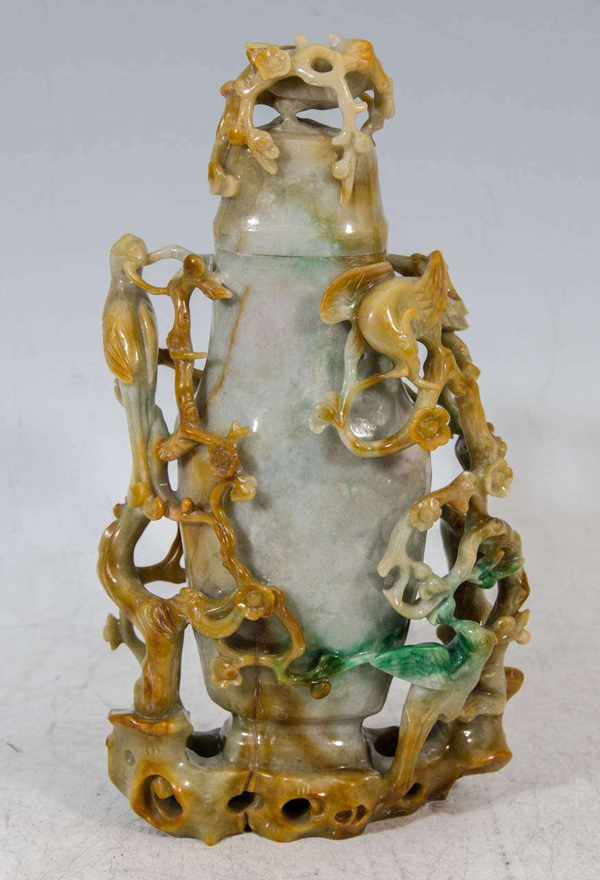 A fine and large three-color jadeite carving with matching top of a vase surrounded by magpie birds and flowering prunus stems [a rebus for the Chinese expression Xishang meishao - Wishing you joy up to your eyebrows!]; the three colors well used to