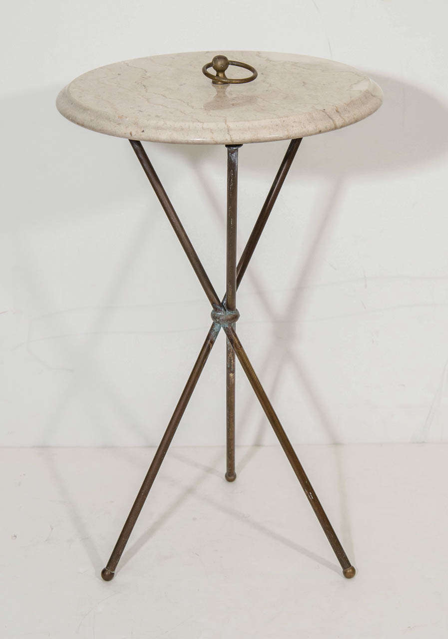 A vintage Italian side or drinks table with a 'sand' colored marble top, unique 'loop' handle, and bronze tripod base. Measurements include: 22