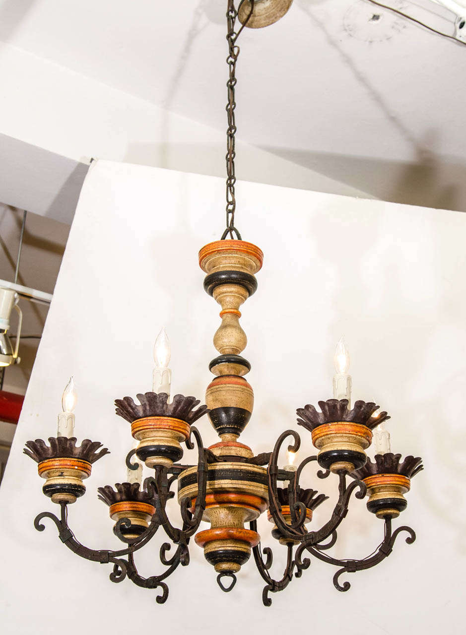 A vintage Italian carved painted wood and metal six-light chandelier.  Newly rewired.

Good vintage condition with age appropriate wear. Some nicks to the wood.

Reduced from: $1,850