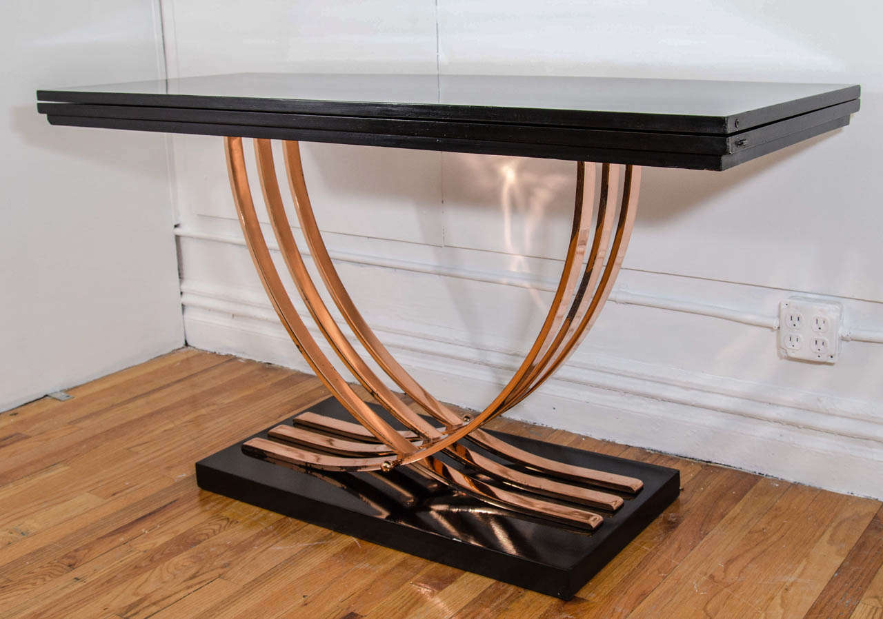 An Amazing Art Deco flip-top console table with Triple Curving  Flat Copper Bands and Solid Copper Ball Accents that interlock for a Great Machine Age look.This Great Piece Flips open for a Larger Area Top,which showcases the Black Lacquered Wood to