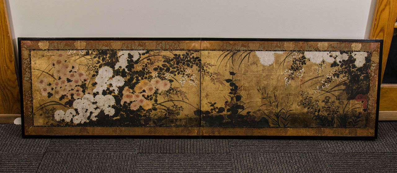 A two panel Japanese screen with Chrysanthemum flowers from the late Momoyama  period

Good condition with age appropriate wear.